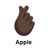 Hand with Index Finger and Thumb Crossed: Dark Skin Tone on Apple iOS