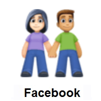 Woman and Man Holding Hands: Light Skin Tone, Medium Skin Tone on Facebook